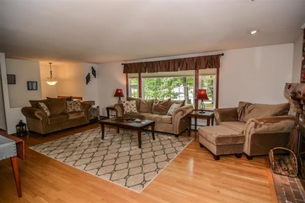 4 Belknap Road Hudson, NH 03051 - Photo 2 of 30 a living room with furniture and a large window