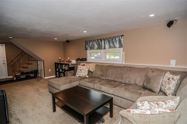 4 Belknap Road Hudson, NH 03051 - Photo 22 of 30 a living room with furniture and a large window