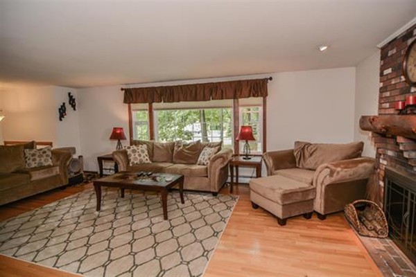 4 Belknap Road Hudson, NH 03051 - Photo 4 of 30 a living room with furniture and a large window