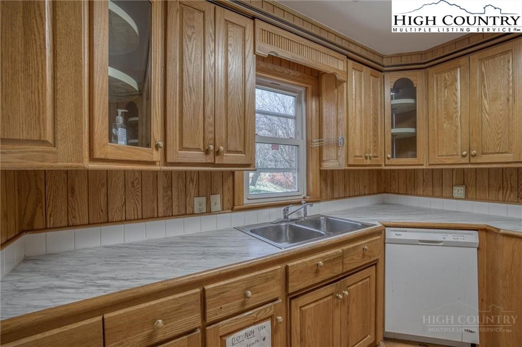 344-348 Tumbling Brook Road Banner Elk, NC 28604 - Photo 7 of 35 a kitchen with a sink cabinets and window