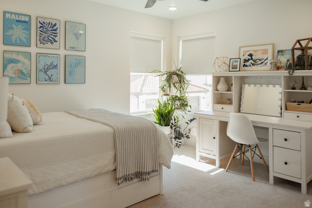 629 Spring Lily Drive St. George, UT 84790 - Photo 22 of 50 Bright room featuring white walls, light-colored carpeting, and a ceiling fan