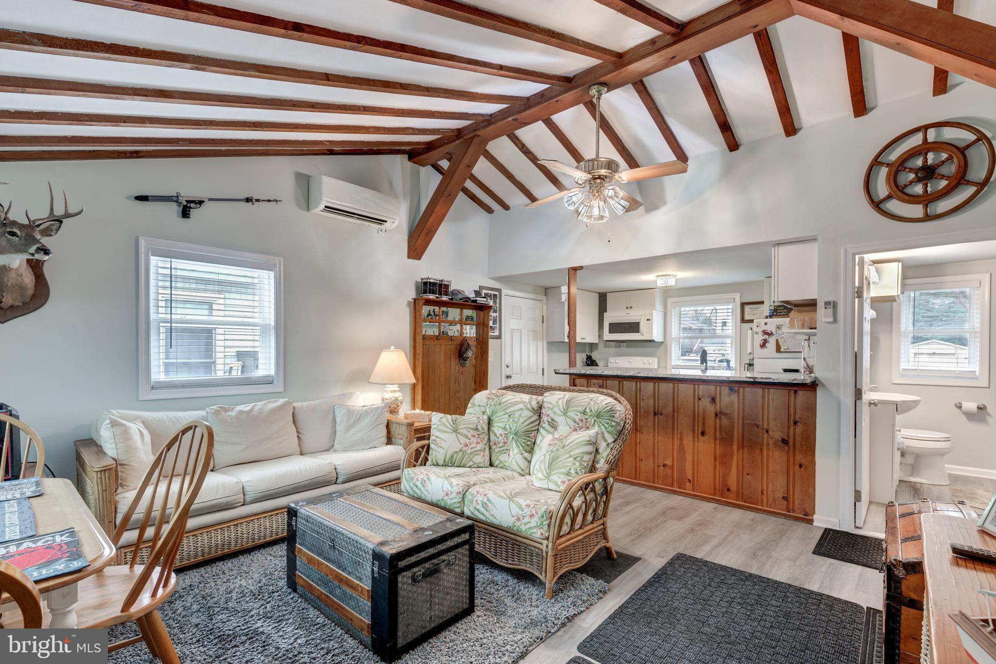 648 Chester River Beach Road Grasonville, MD 21638 - Photo 18 of 62 a living room with furniture and a window