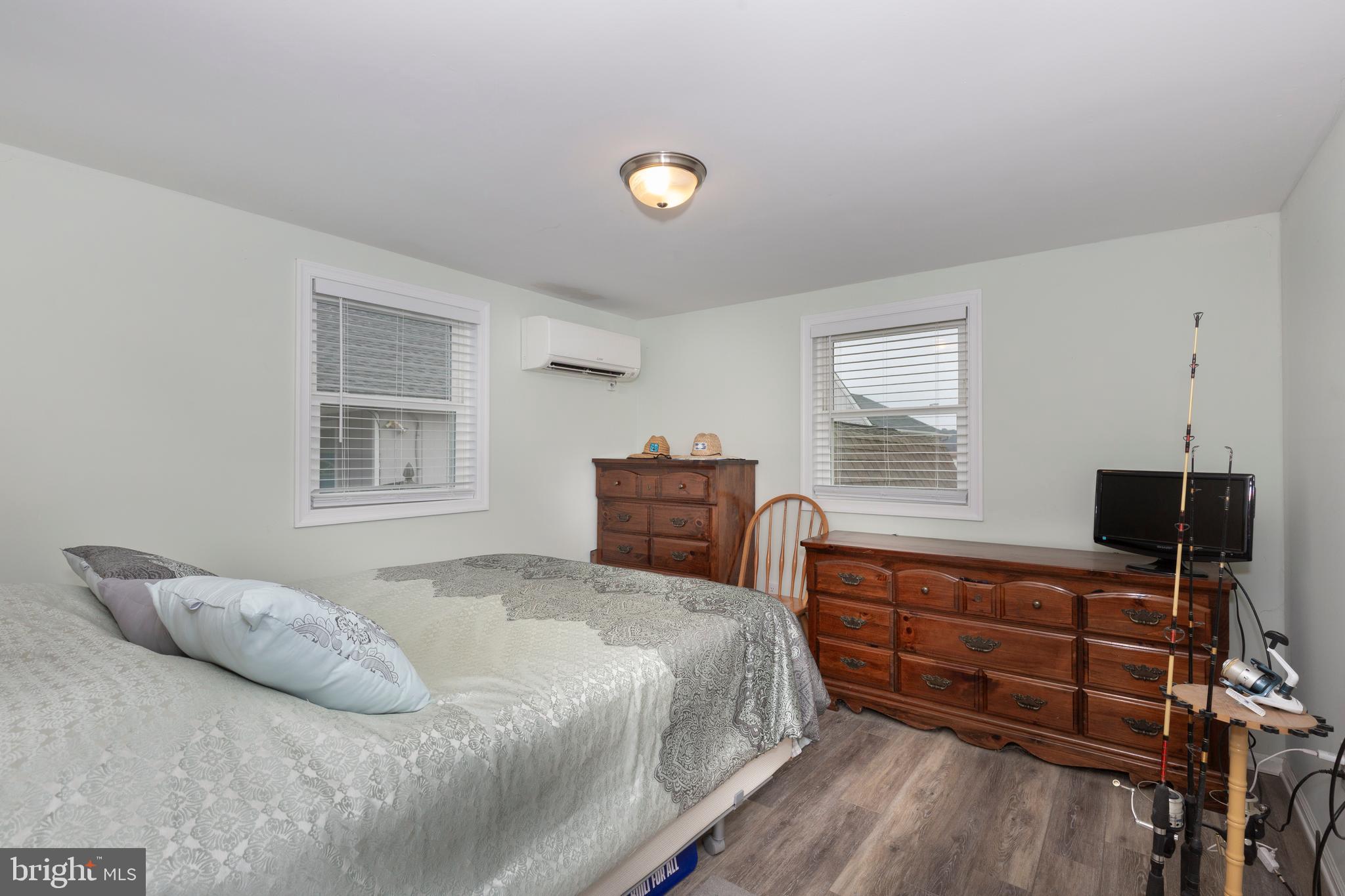 648 Chester River Beach Road Grasonville, MD 21638 - Photo 24 of 62 a bedroom with a bed and a window