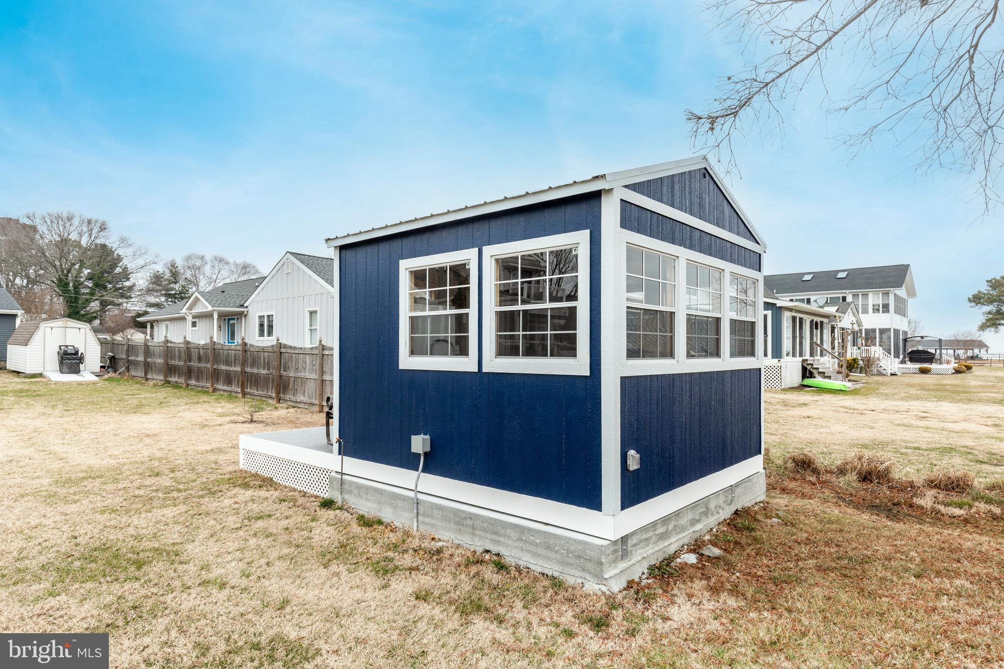 648 Chester River Beach Road Grasonville, MD 21638 - Photo 30 of 62 a view of a house with a yard