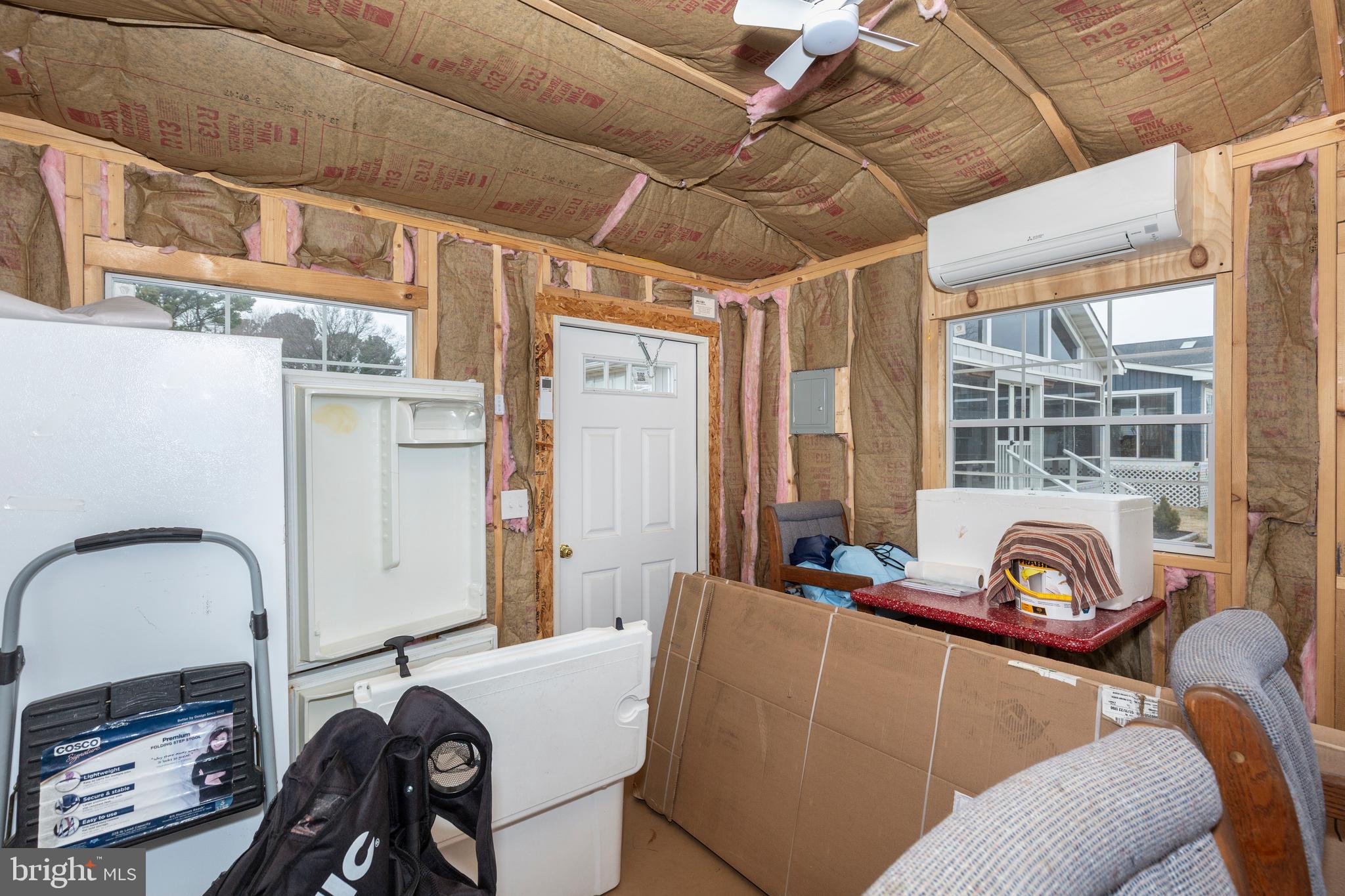 648 Chester River Beach Road Grasonville, MD 21638 - Photo 32 of 62 a living room with furniture and a window