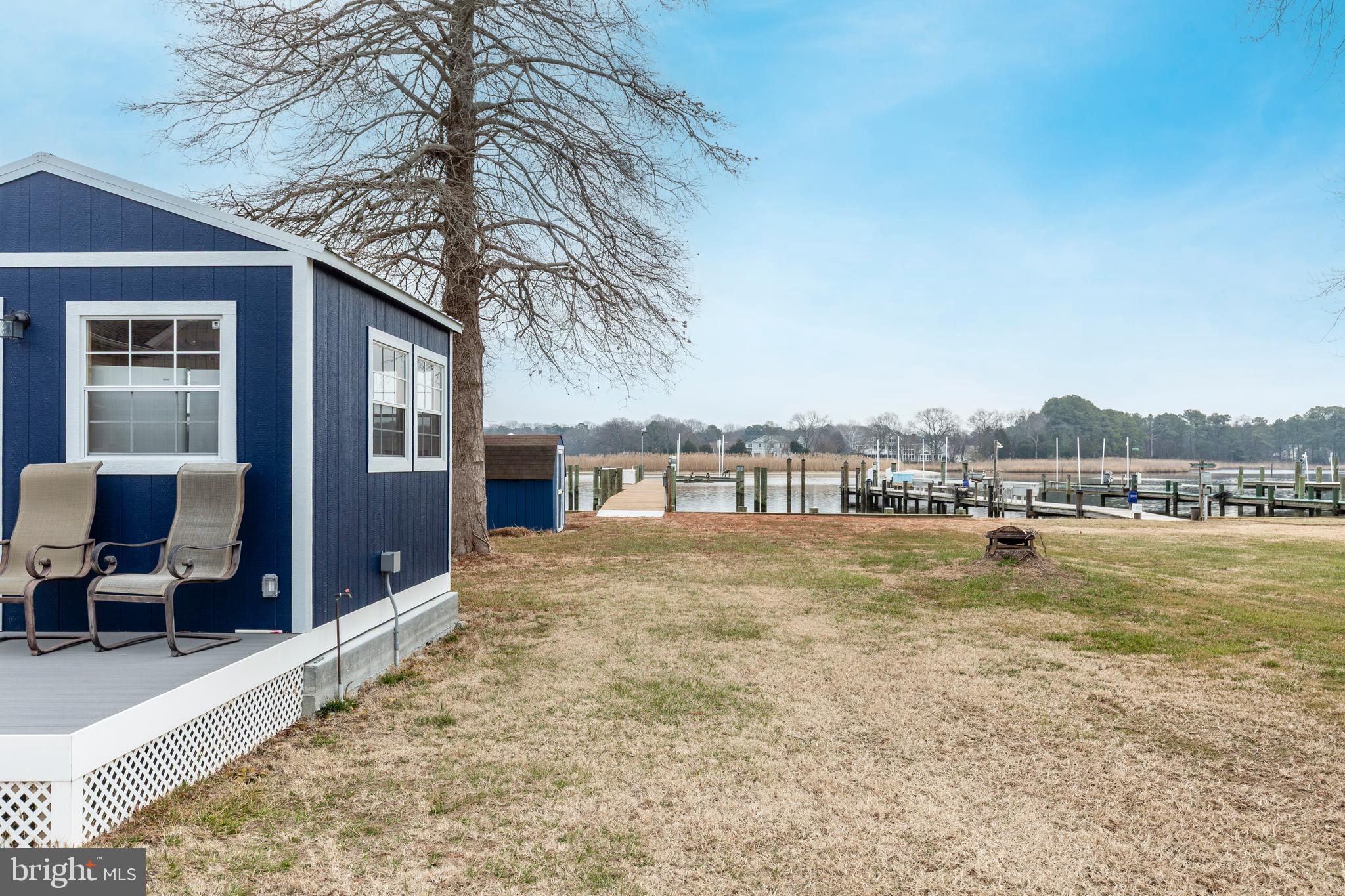 648 Chester River Beach Road Grasonville, MD 21638 - Photo 33 of 62 a view of a house with pool and a yard