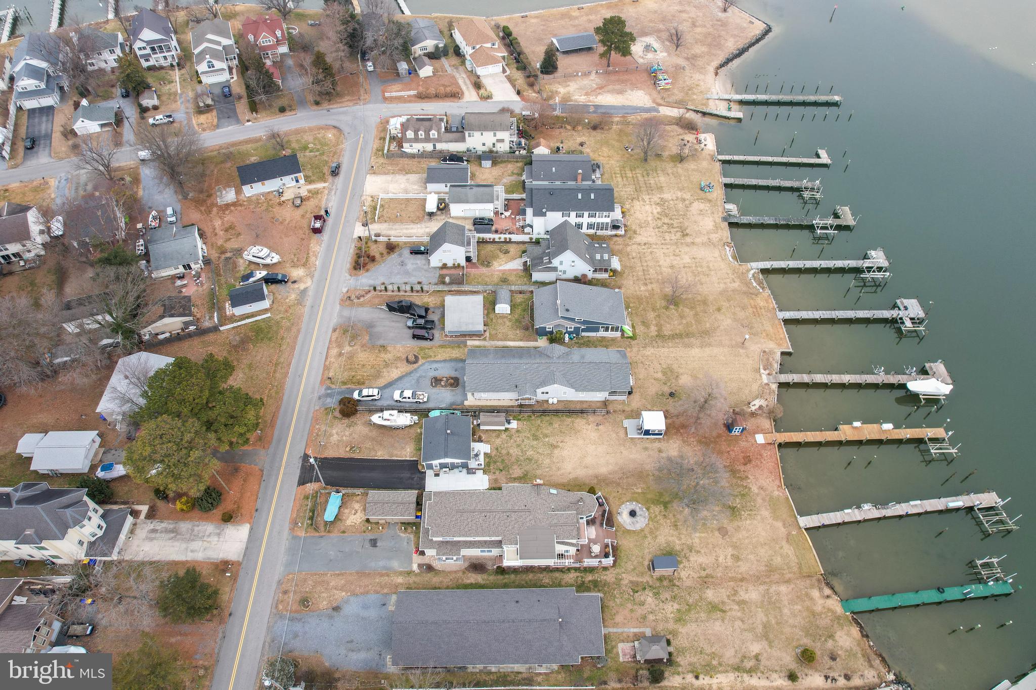 648 Chester River Beach Road Grasonville, MD 21638 - Photo 42 of 62 an aerial view of residential houses with outdoor space