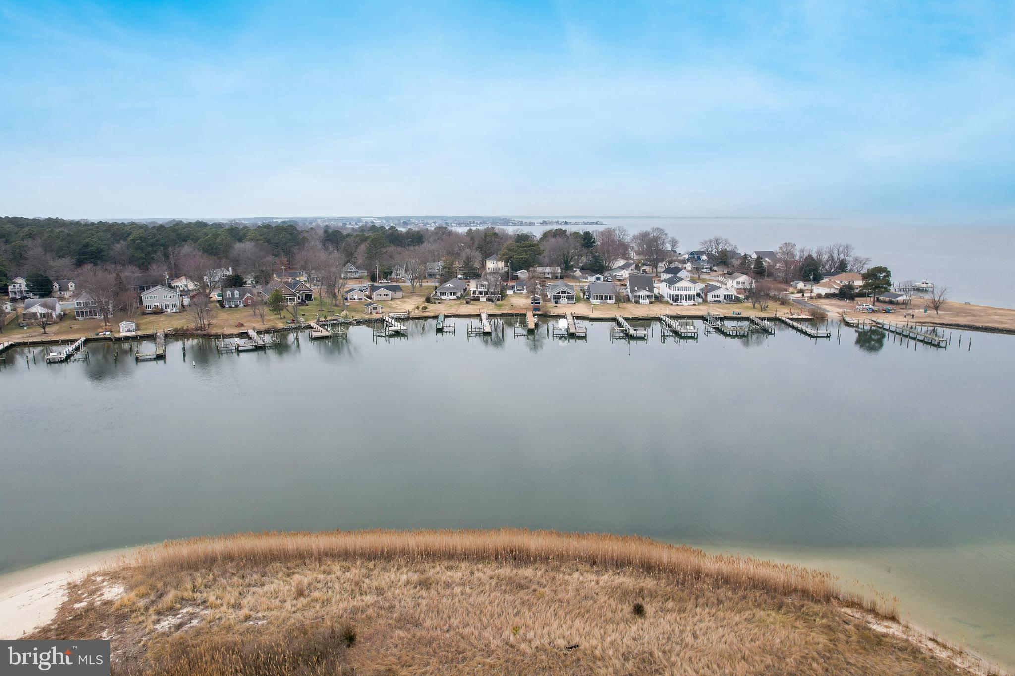648 Chester River Beach Road Grasonville, MD 21638 - Photo 49 of 62 a view of a lake with houses