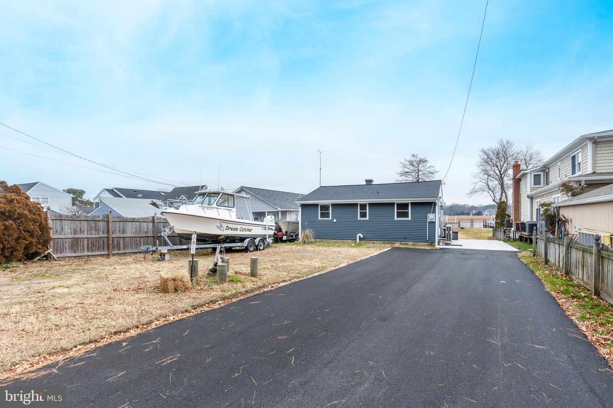 648 Chester River Beach Road Grasonville, MD 21638 - Photo 55 of 62 a view of a lake with a house