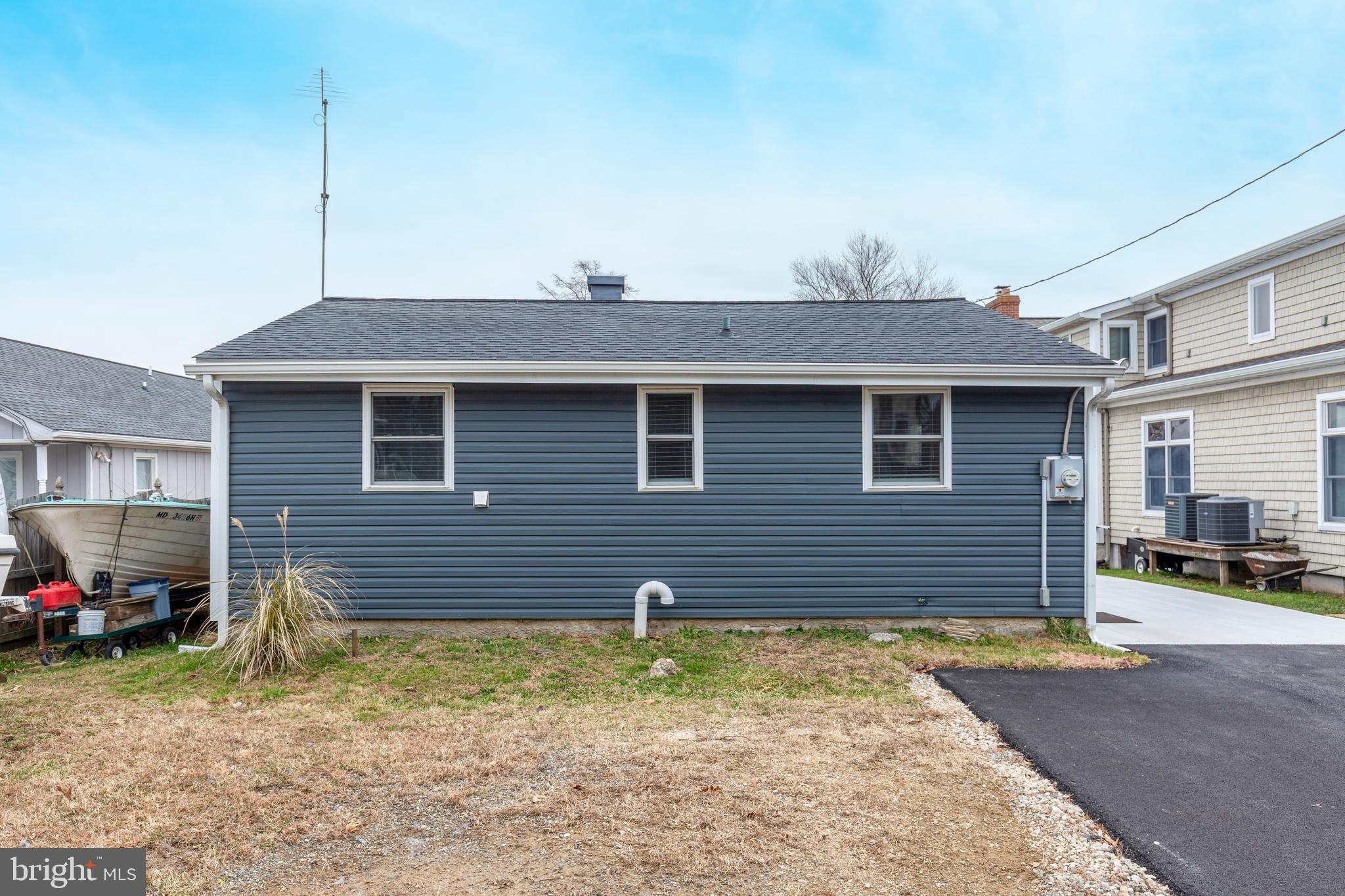 648 Chester River Beach Road Grasonville, MD 21638 - Photo 56 of 62 a front view of a house with a yard