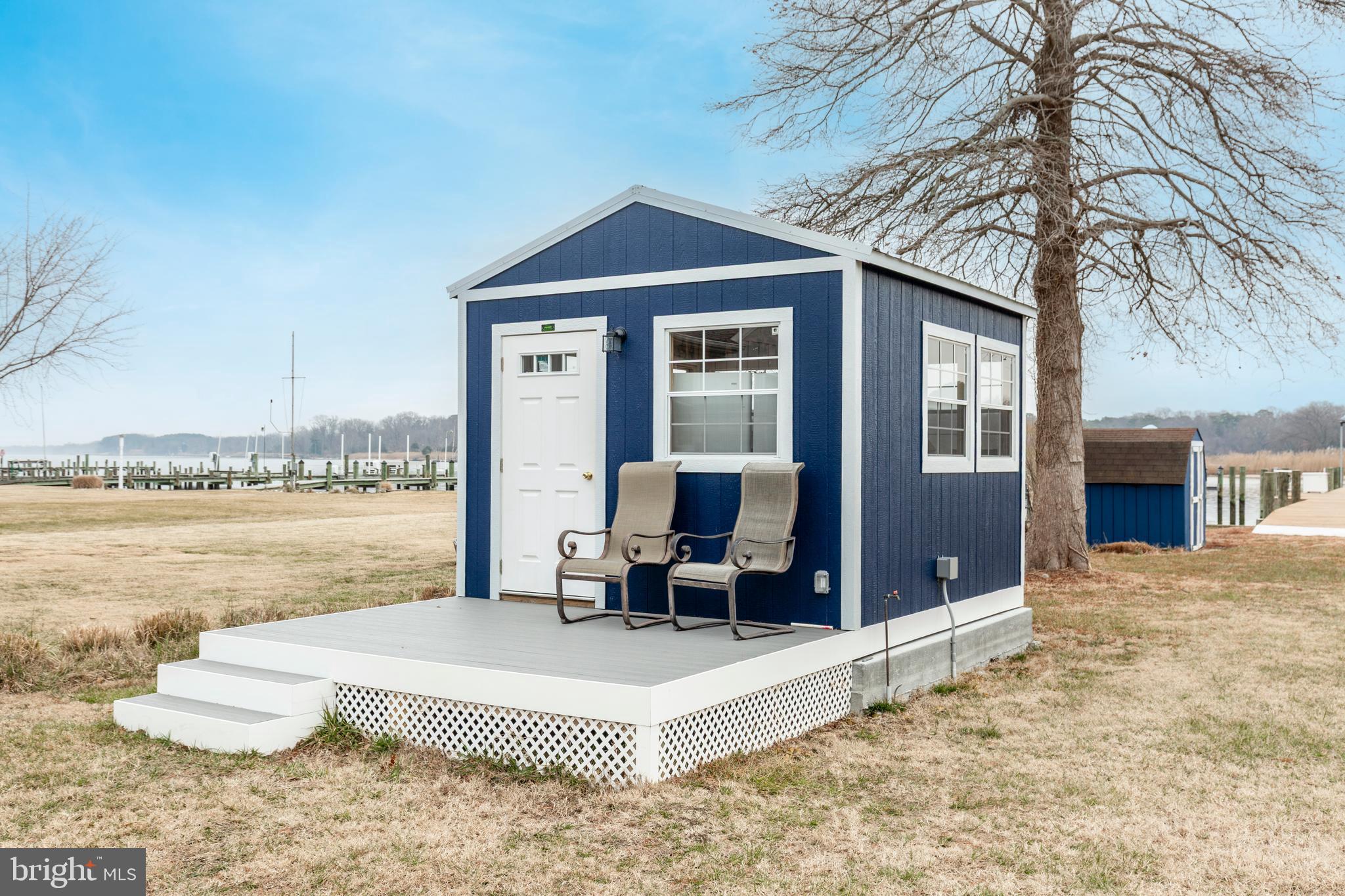 648 Chester River Beach Road Grasonville, MD 21638 - Photo 8 of 62 a front view of a house with a ocean view