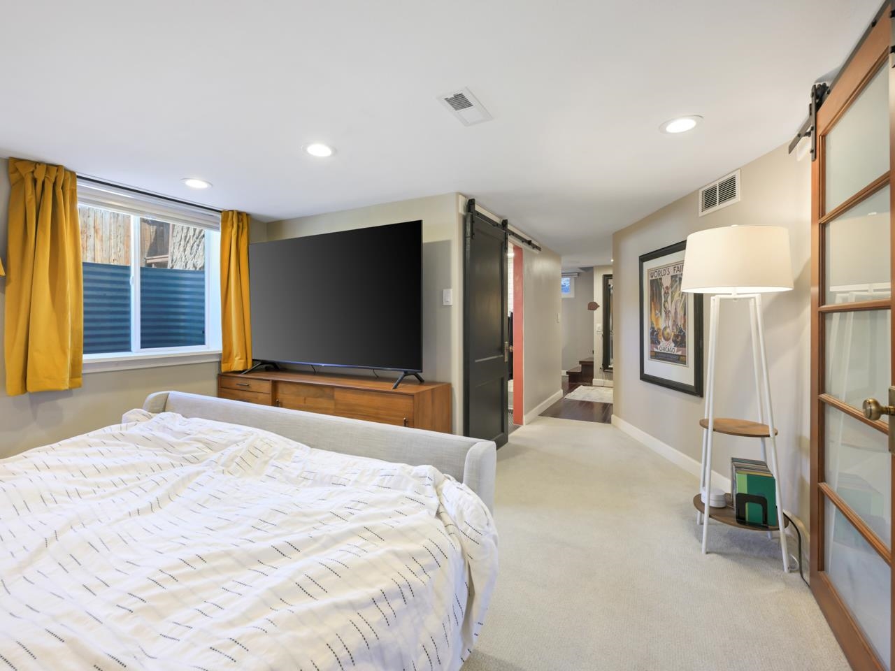 603-26 26 3/4 Road Grand Junction, CO 81506 - Photo 22 of 39 a bedroom with a bed and a flat screen tv