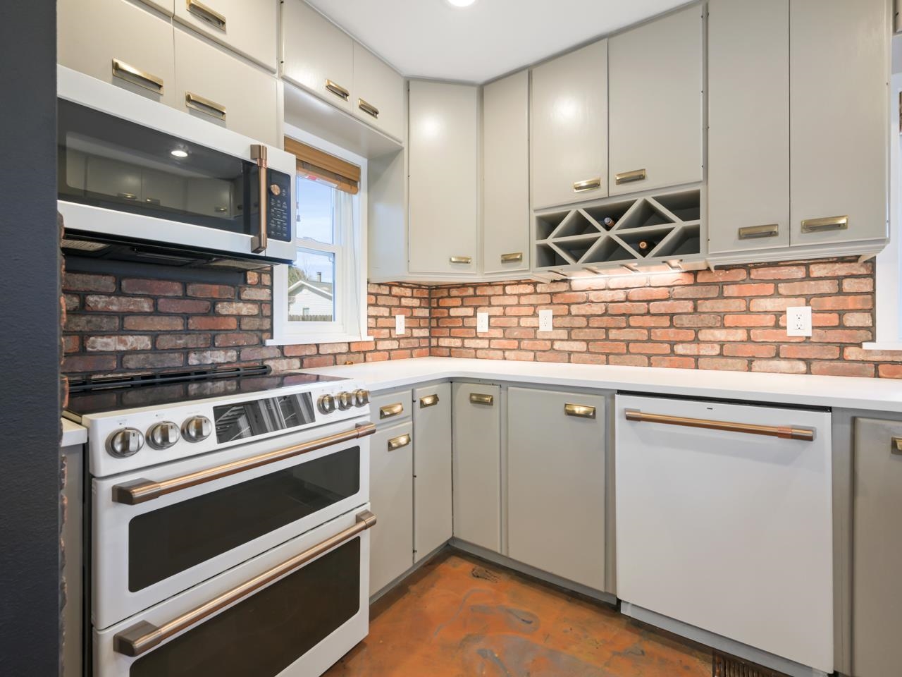603-26 26 3/4 Road Grand Junction, CO 81506 - Photo 8 of 39 a kitchen with granite countertop a stove and a sink