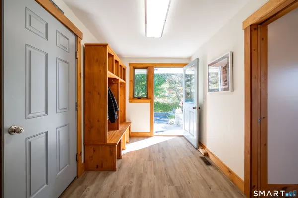a view of front door with wooden floor