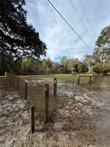 a view of a lake with outdoor seating