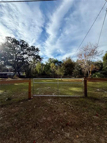 a view of a golf course with a lake
