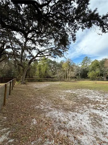a view of outdoor space with deck and yard