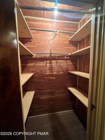 a view of entryway and wooden floor
