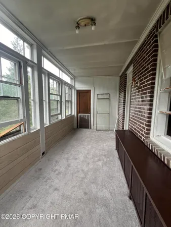 a view of room with window and ceiling fan