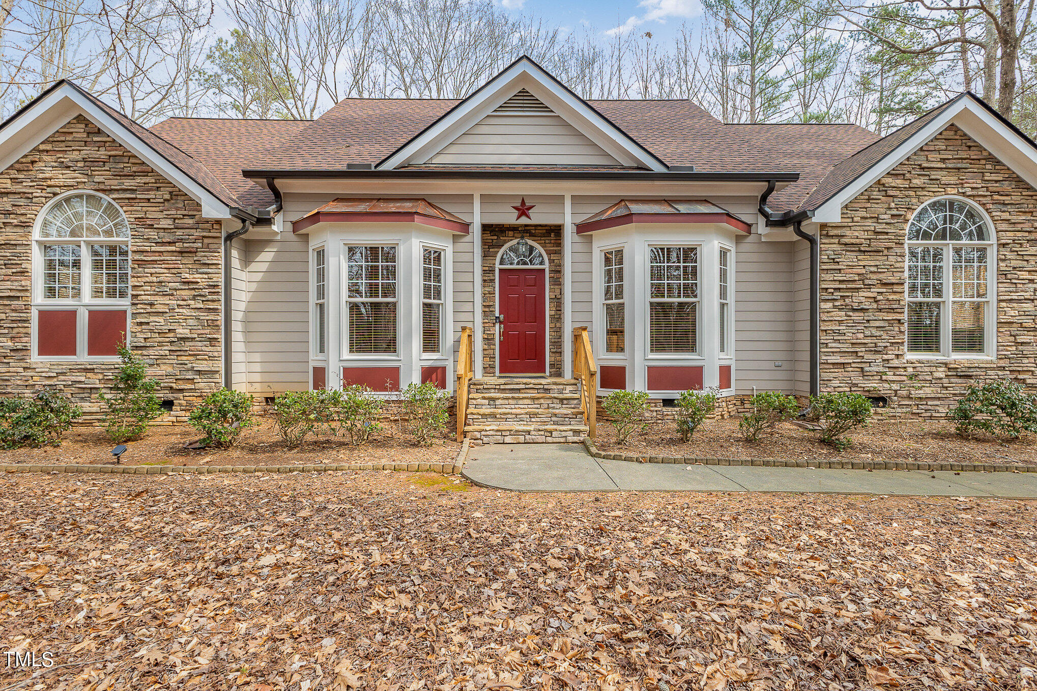 front view of a house with a yard