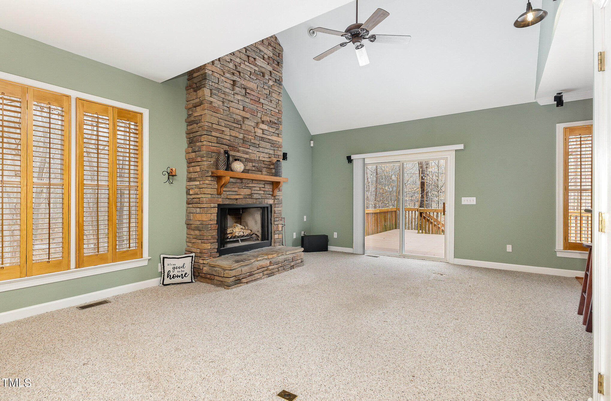2308 Mt Vernon Church Road Raleigh, NC 27614 - Photo 10 of 59 a view of an empty room with a fireplace and a window