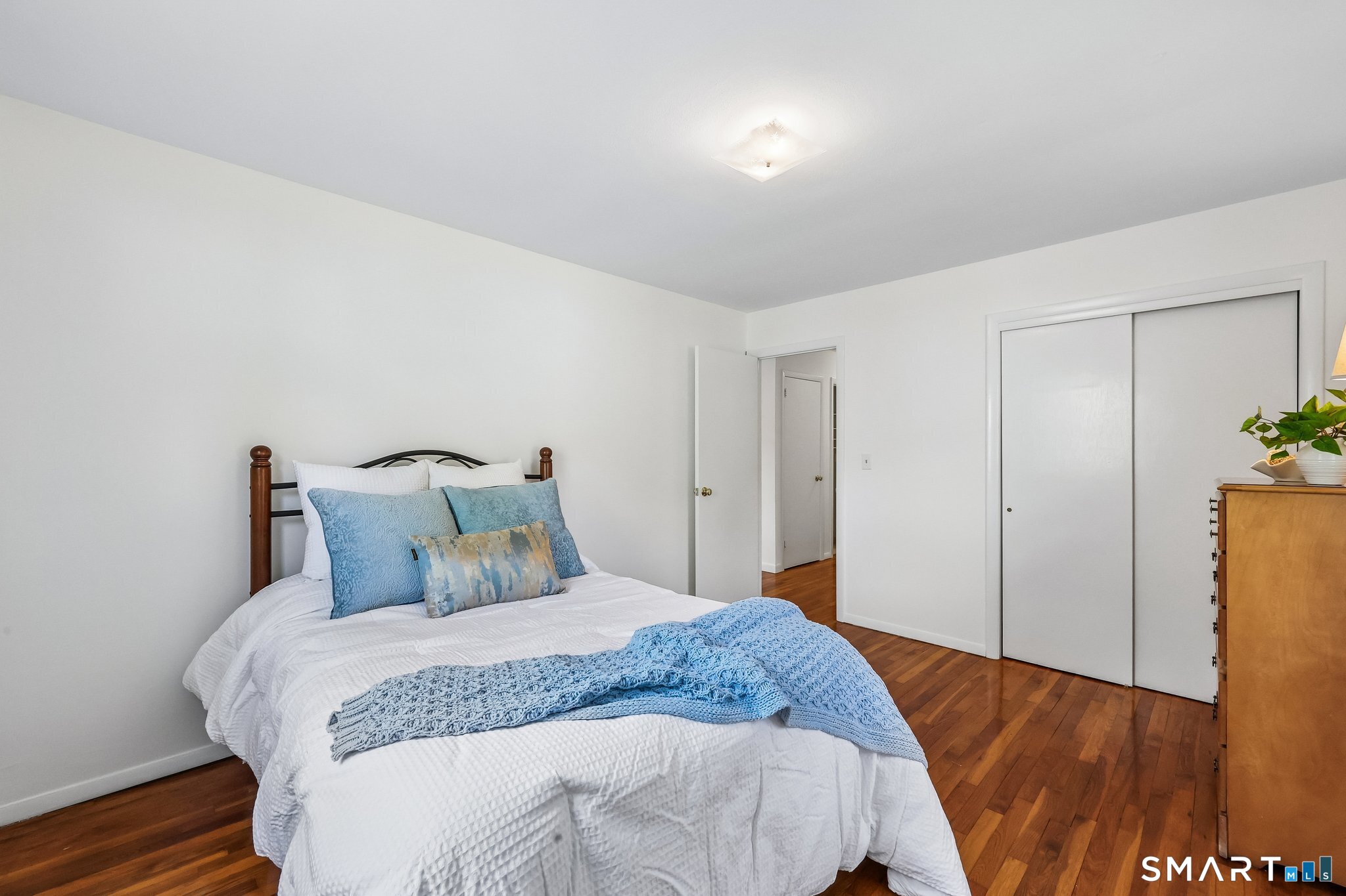 53 Chalker Beach Road Old Saybrook, CT 06475 - Photo 12 of 24 Primary bedroom with hardwood flooring.