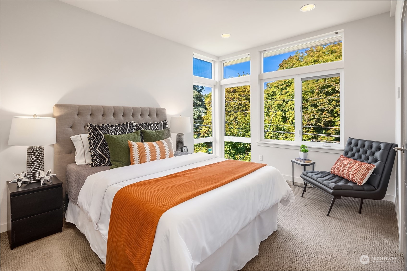 417 North 50th Street Seattle, WA 98103 - Photo 12 of 30 a bedroom with a bed and a chair