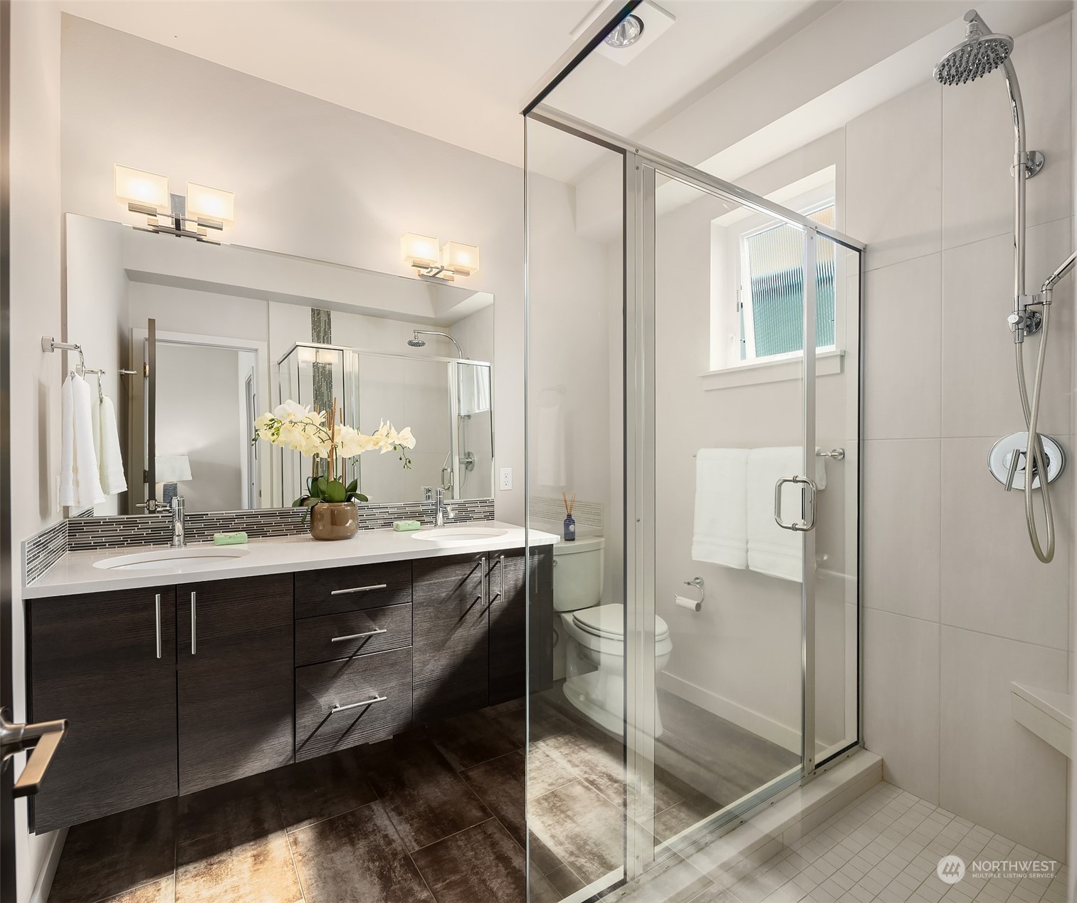 417 North 50th Street Seattle, WA 98103 - Photo 13 of 30 a bathroom with a double vanity sink mirror and toilet