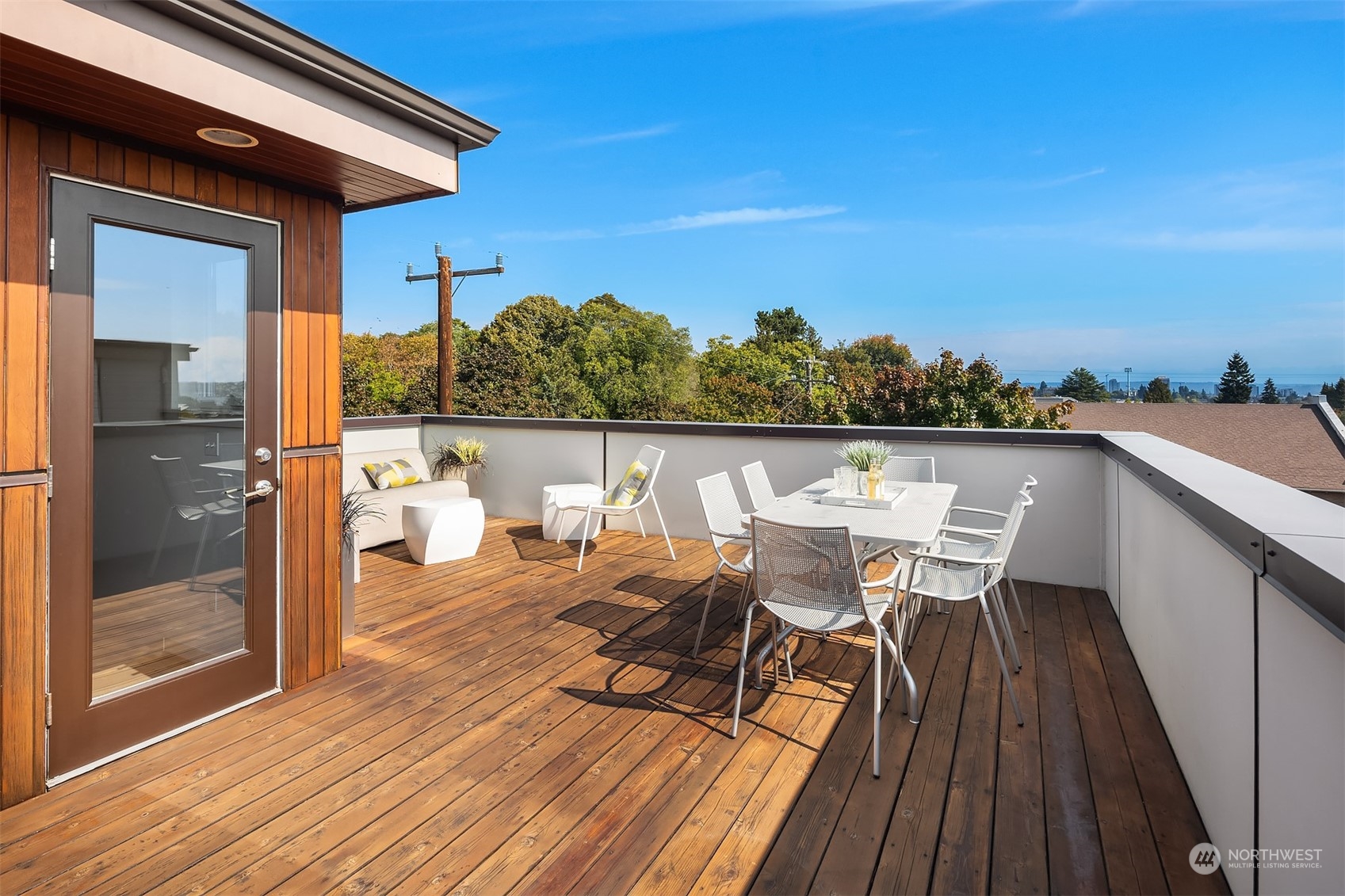 417 North 50th Street Seattle, WA 98103 - Photo 17 of 30 a view of a balcony with table and chairs