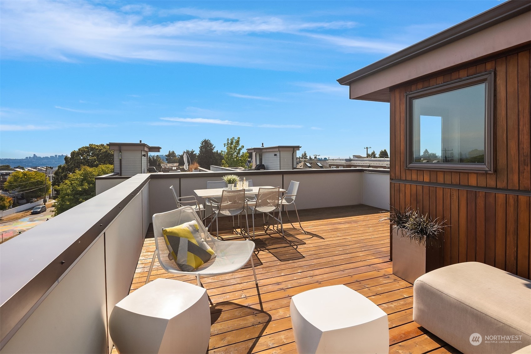417 North 50th Street Seattle, WA 98103 - Photo 19 of 30 a balcony with table and chairs