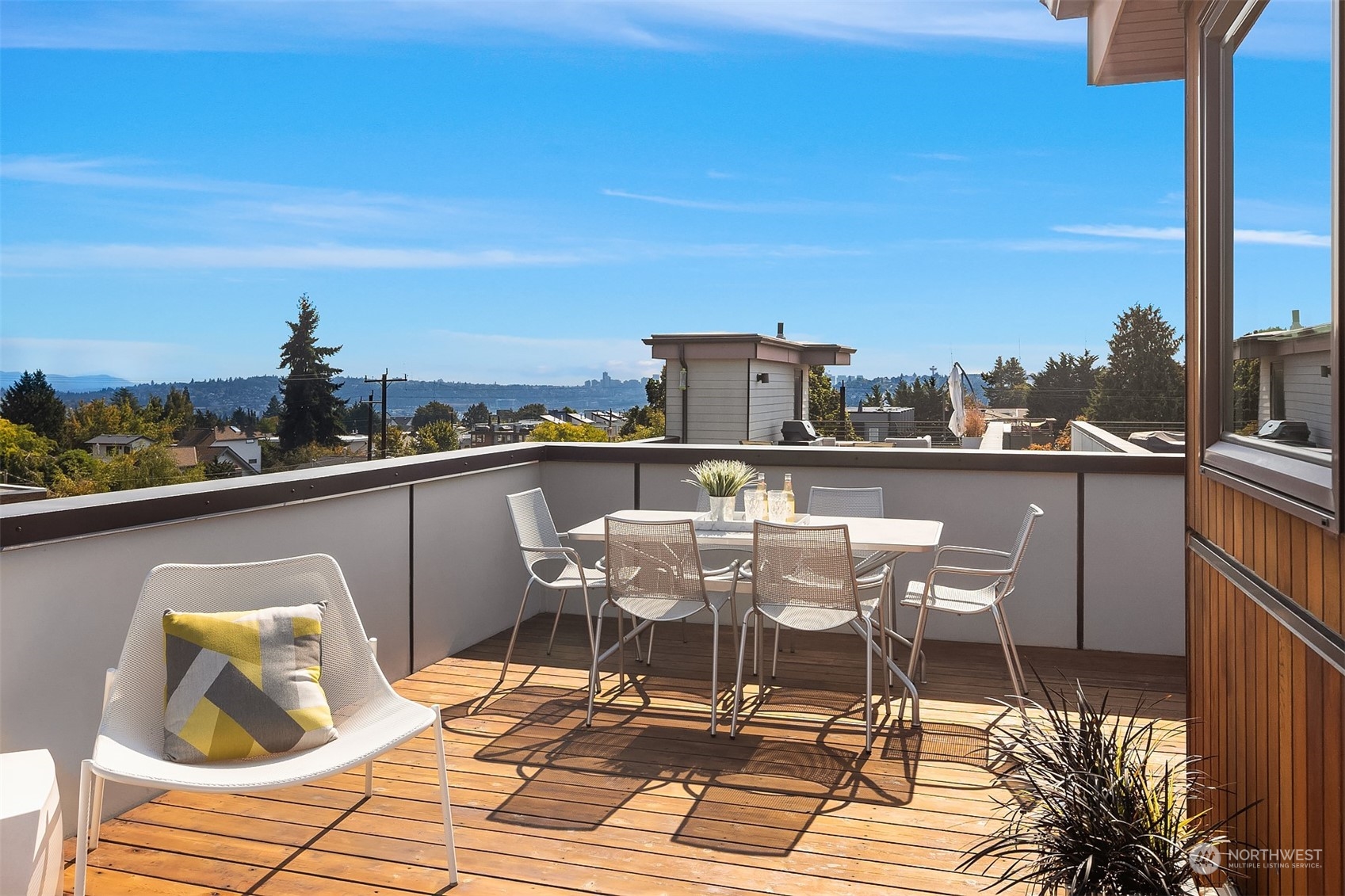 417 North 50th Street Seattle, WA 98103 - Photo 20 of 30 a view of a roof deck with table and chairs