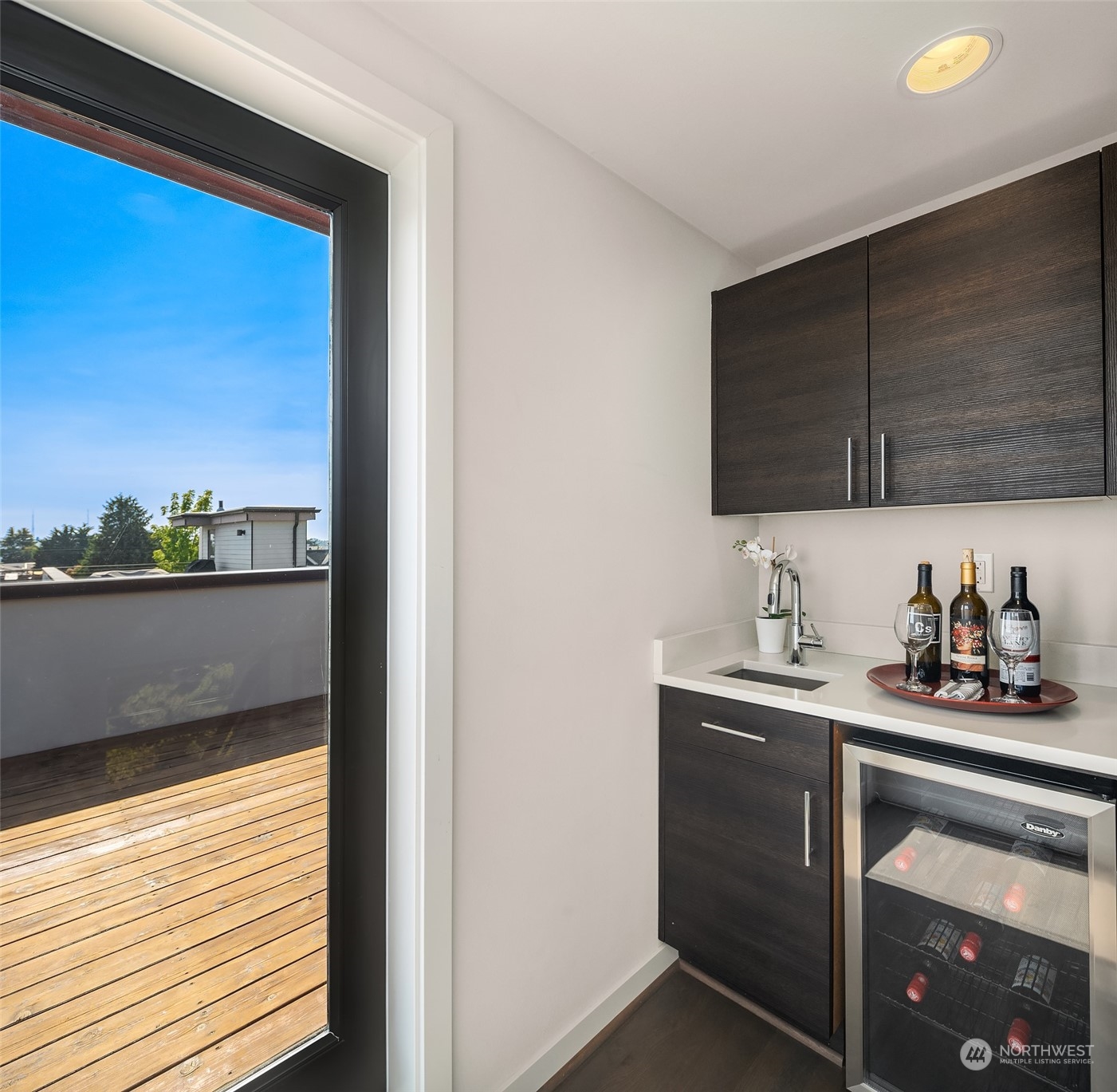 417 North 50th Street Seattle, WA 98103 - Photo 23 of 30 a kitchen with stainless steel appliances granite countertop a sink and a microwave