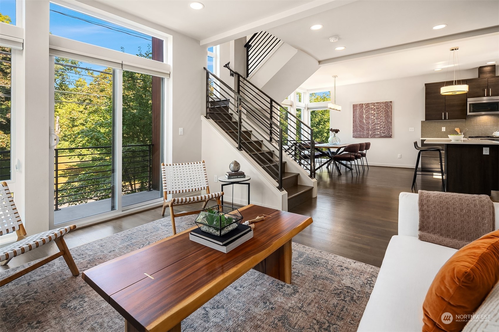 417 North 50th Street Seattle, WA 98103 - Photo 3 of 30 a living room with furniture and wooden floor