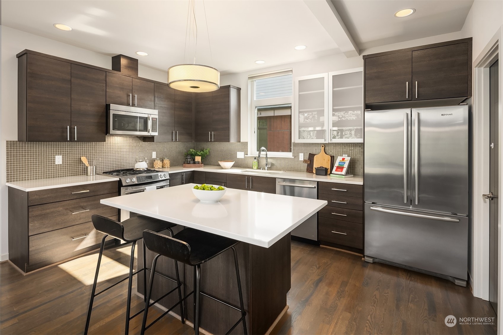 417 North 50th Street Seattle, WA 98103 - Photo 6 of 30 a kitchen with a refrigerator a sink and a stove