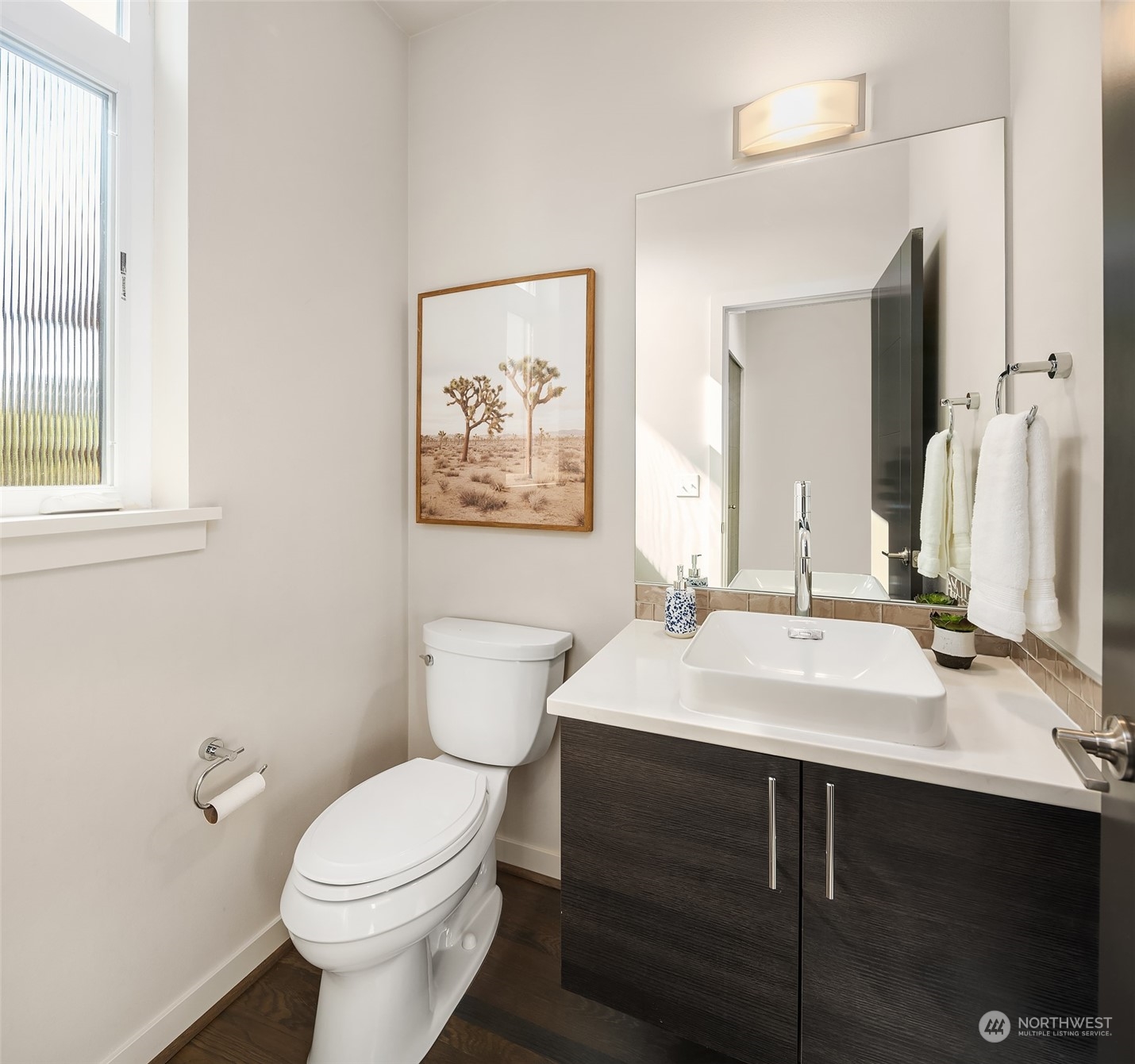 417 North 50th Street Seattle, WA 98103 - Photo 10 of 30 a bathroom with a sink vanity mirror and toilet