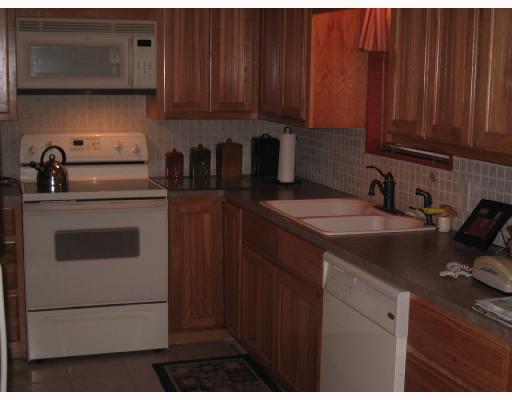 11350 Highway 359 Sandia, TX 78383 - Photo 3 of 10 a kitchen with stainless steel appliances granite countertop a sink stove and refrigerator