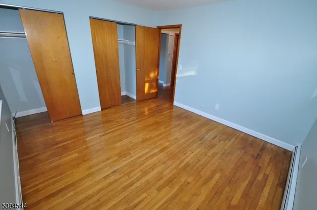 a view of an empty room with windows