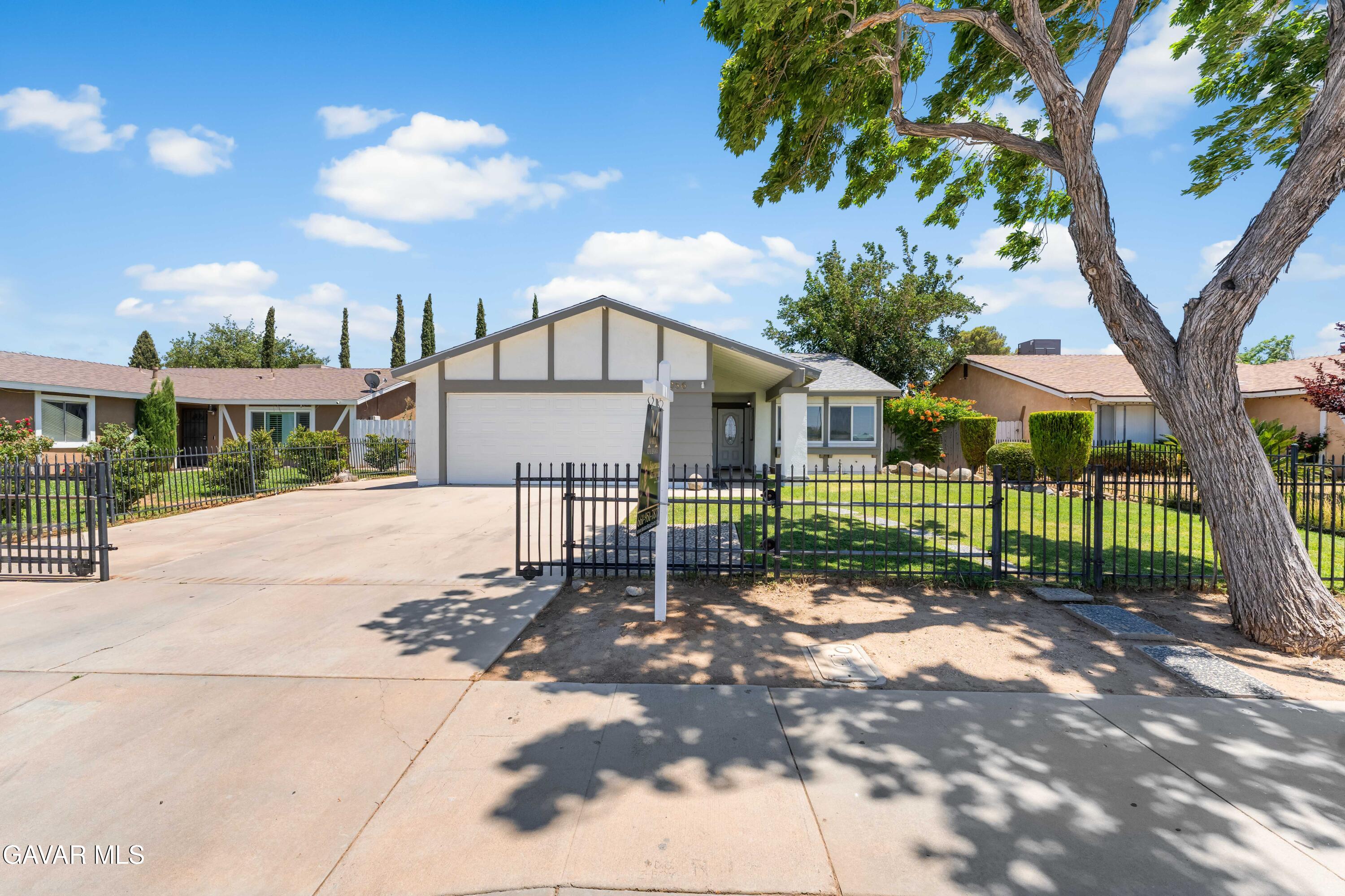 39056 Dianron Road Palmdale, CA 93551 - Photo 1 of 35 a view of a house with a yard