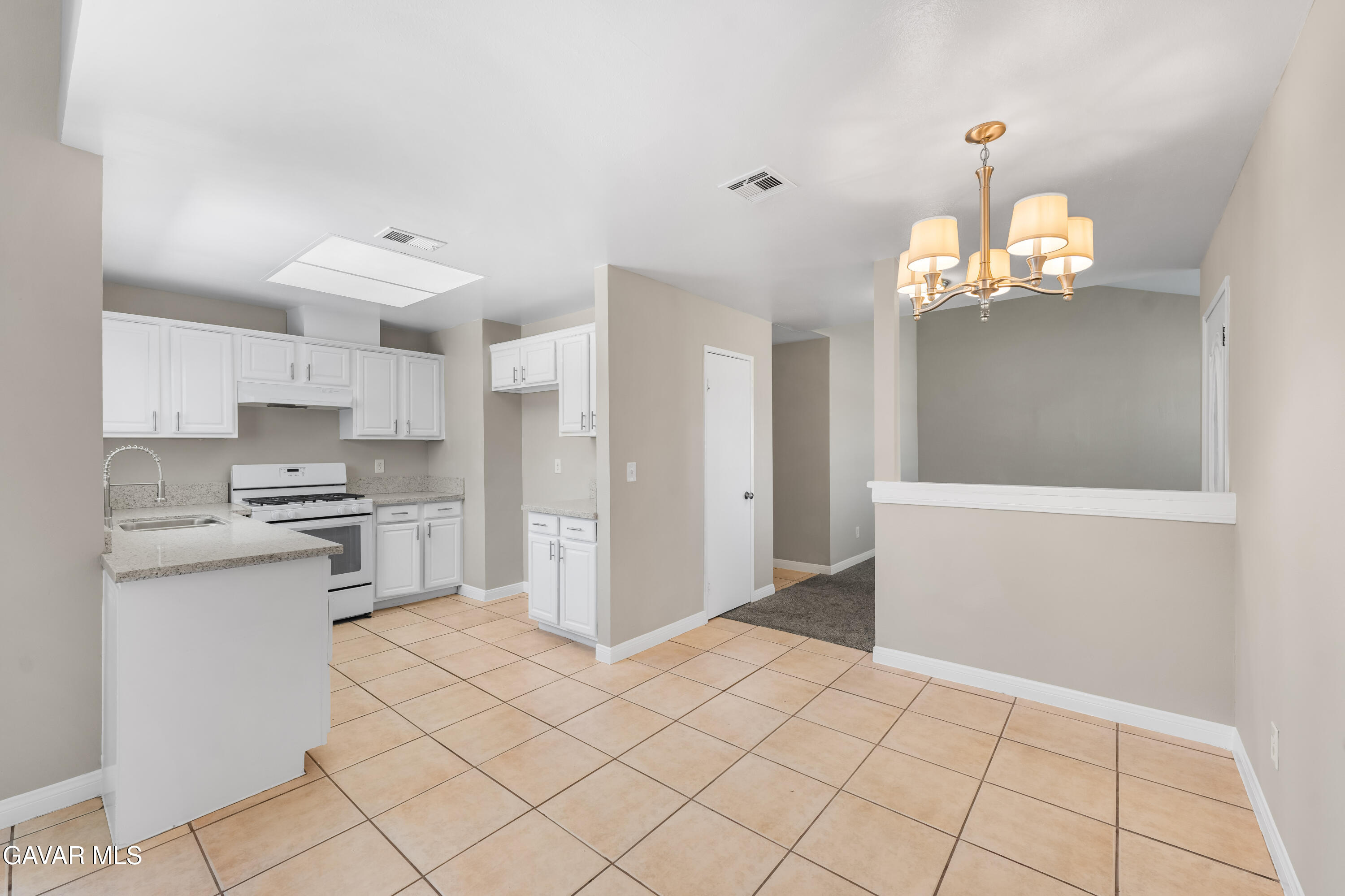 39056 Dianron Road Palmdale, CA 93551 - Photo 12 of 35 a view of a kitchen with electric appliances