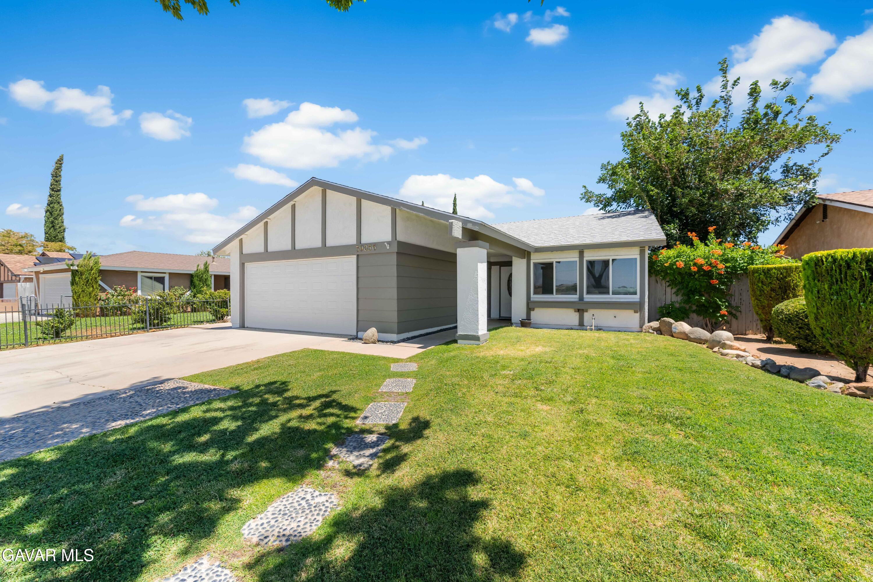39056 Dianron Road Palmdale, CA 93551 - Photo 2 of 35 a front view of a house with a yard