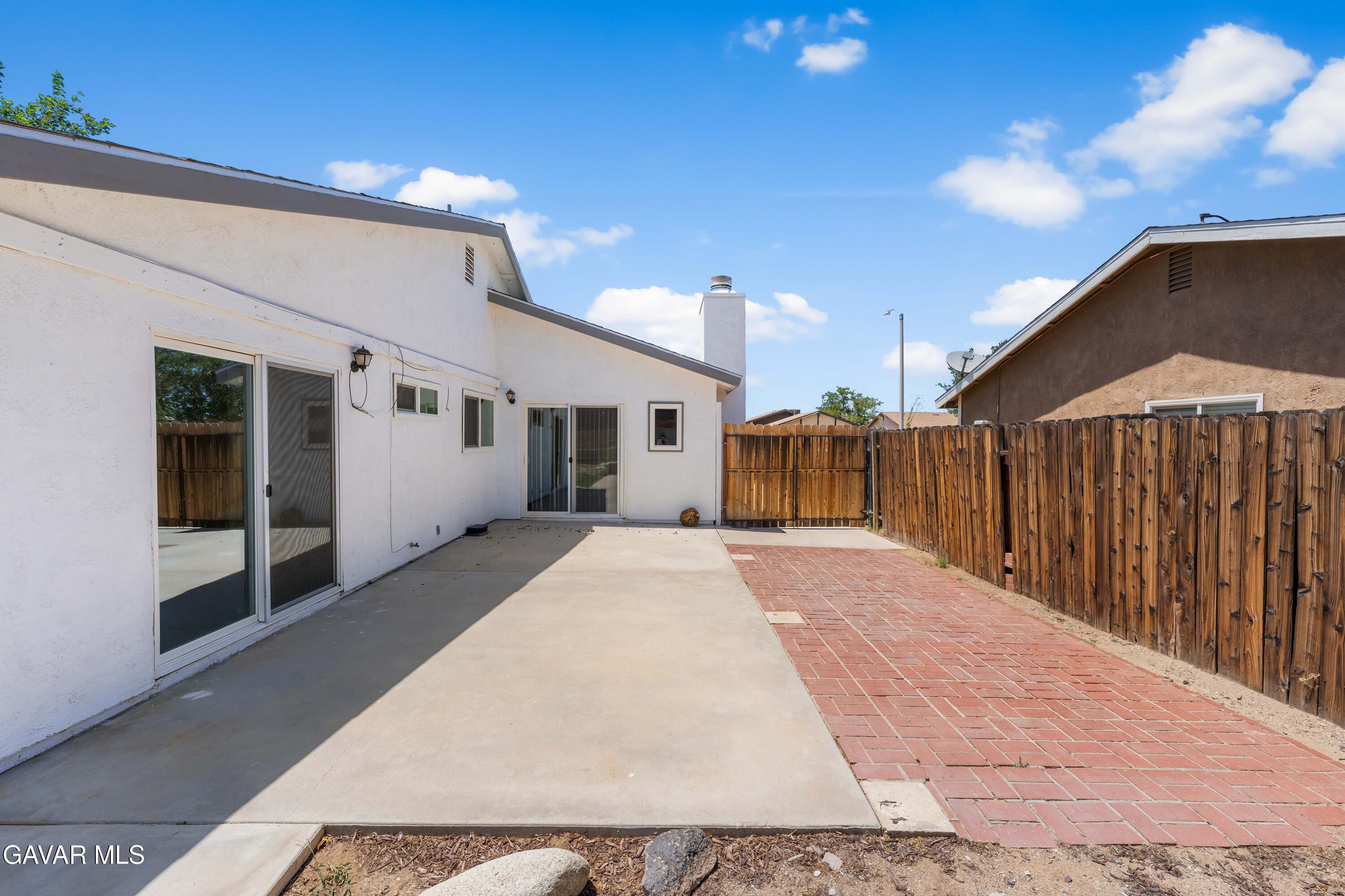 39056 Dianron Road Palmdale, CA 93551 - Photo 31 of 35 a view of a house with a backyard