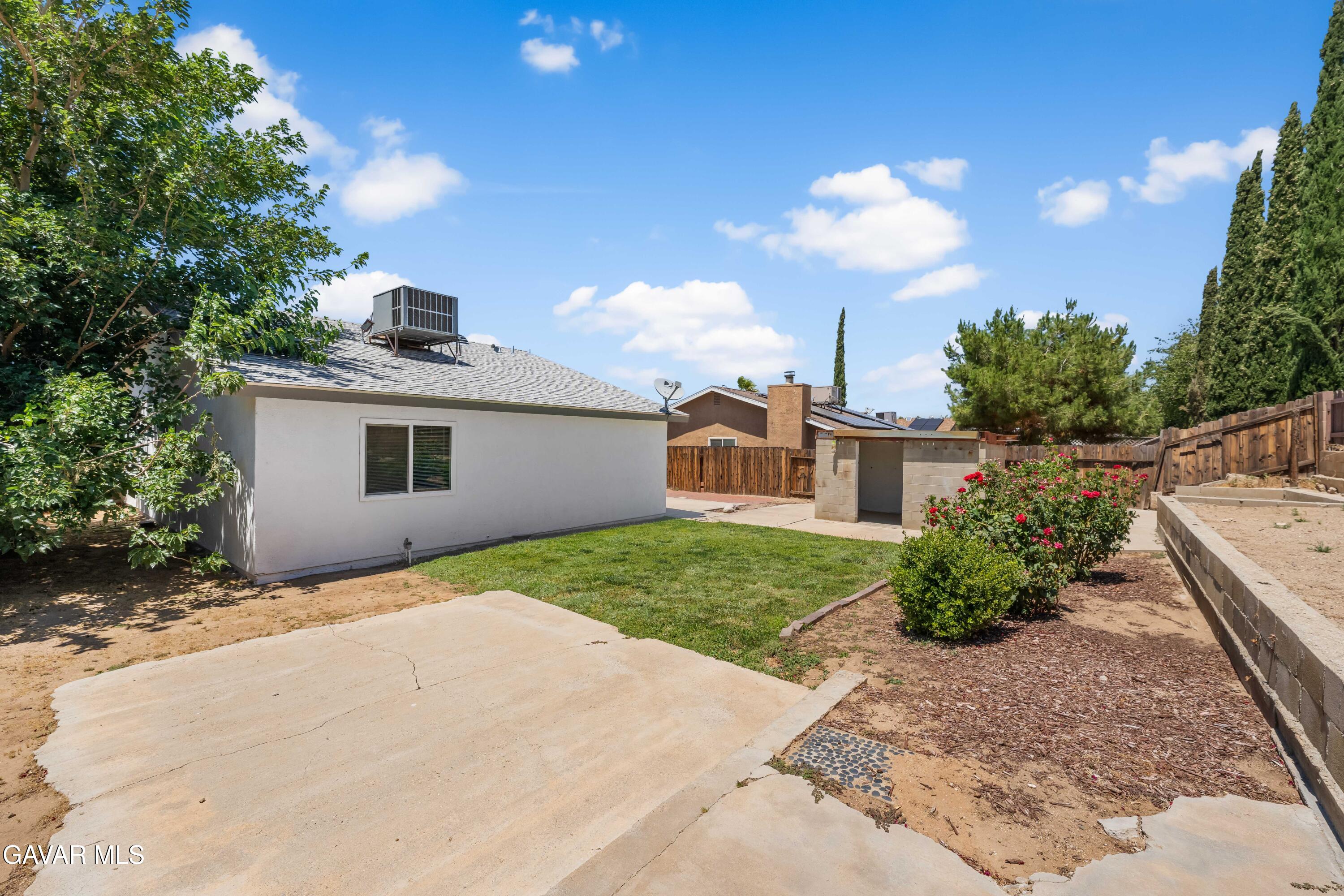 39056 Dianron Road Palmdale, CA 93551 - Photo 34 of 35 a pathway of a house with a yard