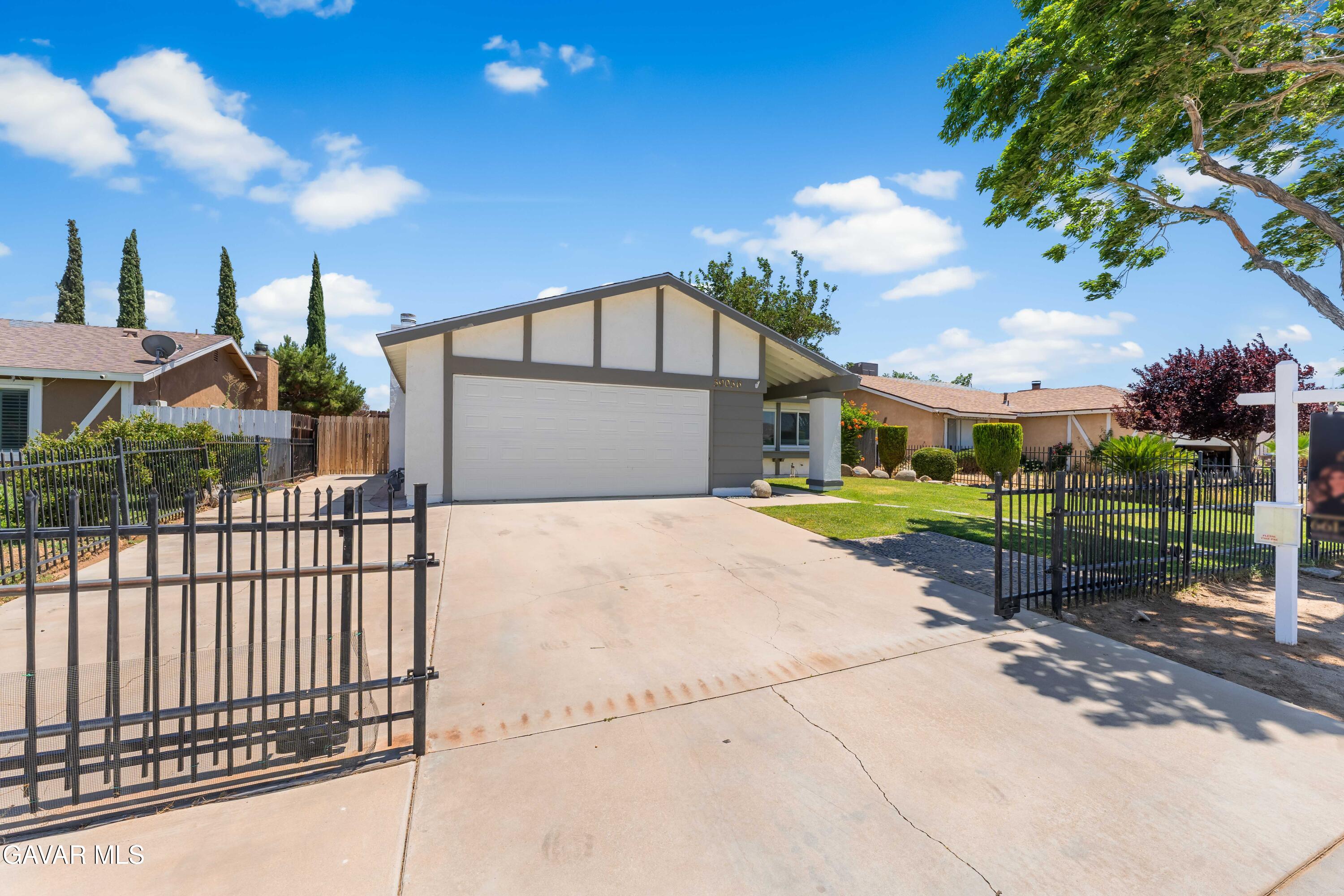39056 Dianron Road Palmdale, CA 93551 - Photo 4 of 35 a view of a garden with a bench