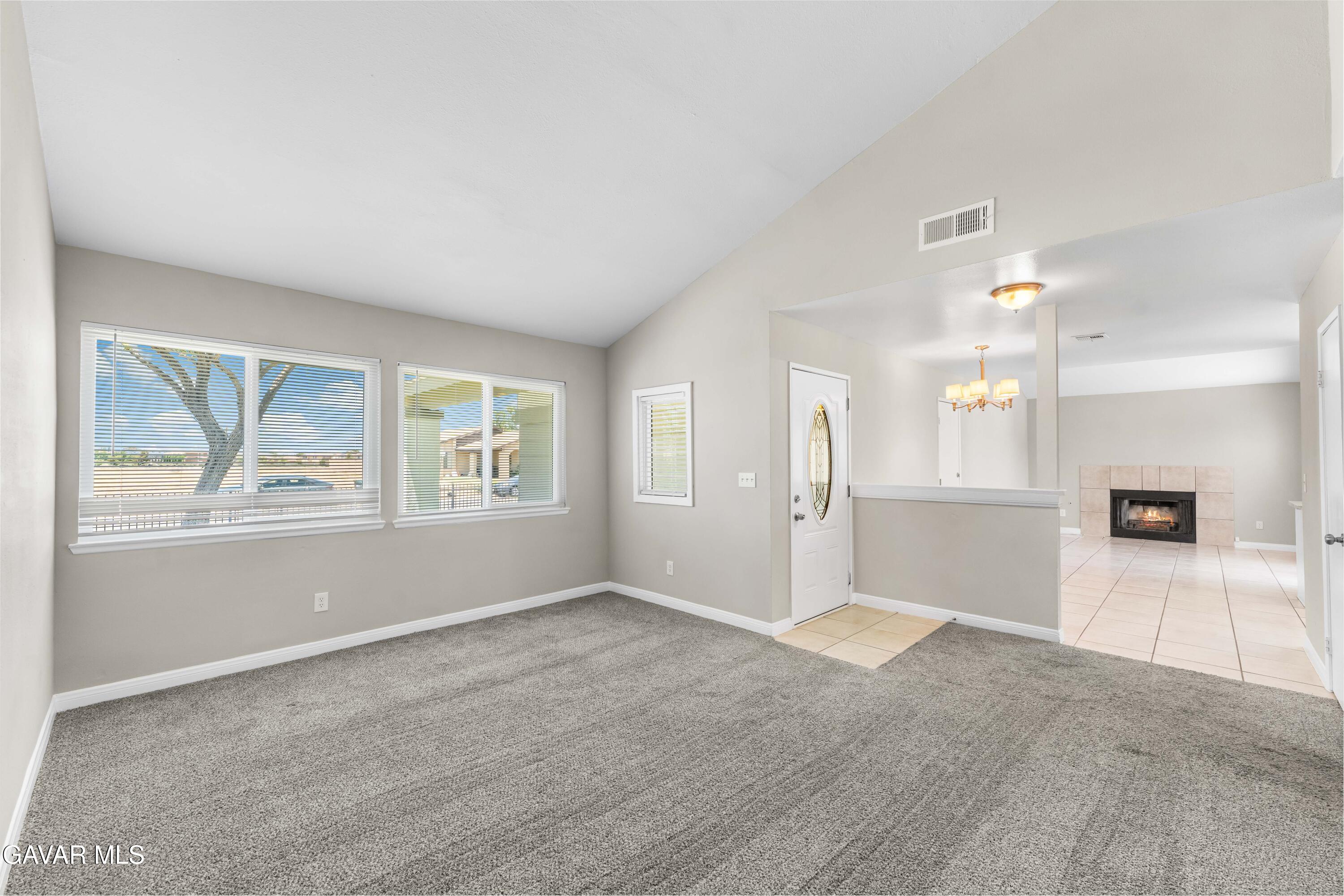 39056 Dianron Road Palmdale, CA 93551 - Photo 6 of 35 a view of an empty room with a window