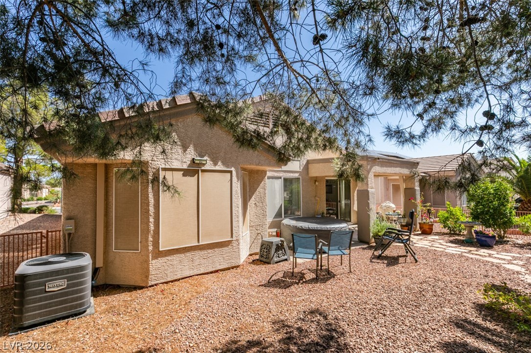 2187 Chapman Ranch Drive Henderson, NV 89012 - Photo 25 of 26 This tranquil backyard oasis offers comfortable seating and a relaxing spa, perfect for unwinding.