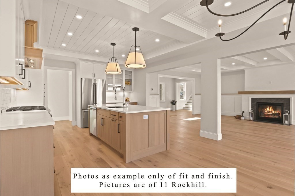 3 Rockhill Road Sandwich, MA 02537 - Photo 6 of 14 a large kitchen with kitchen island a stove a sink a refrigerator and a fireplace