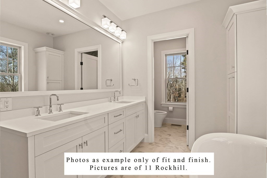 3 Rockhill Road Sandwich, MA 02537 - Photo 9 of 14 a bathroom with a sink a toilet and a mirror