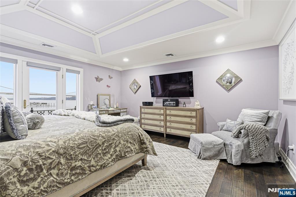 119 Hudson Cove Edgewater, NJ 07020 - Photo 27 of 44 a bedroom with a bed and flat screen tv