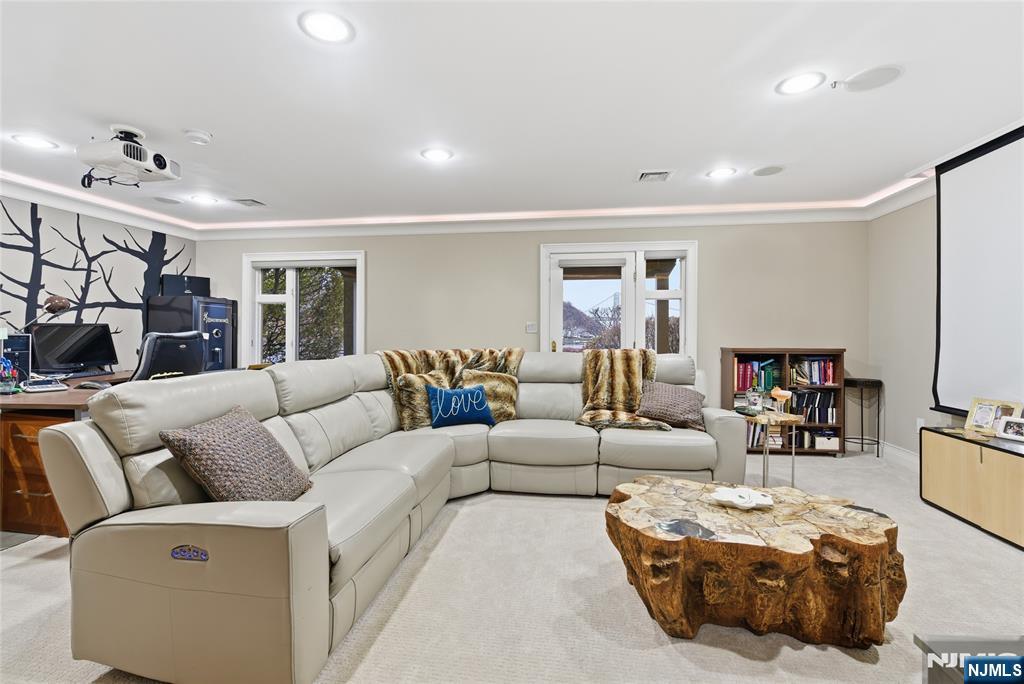 119 Hudson Cove Edgewater, NJ 07020 - Photo 40 of 44 a living room with furniture and a flat screen tv
