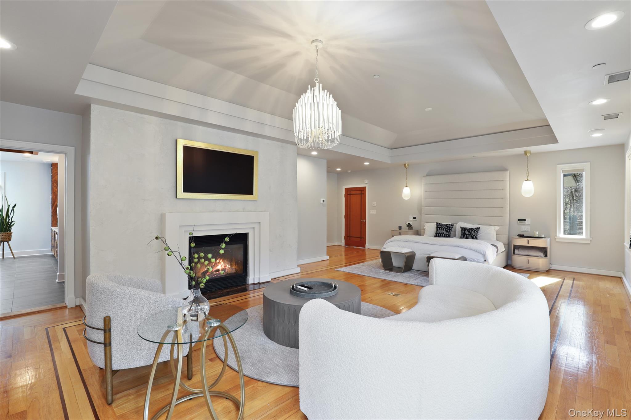54 Lincoln Avenue Rye Brook, NY 10577 - Photo 21 of 38 a living room with fireplace furniture and a chandelier